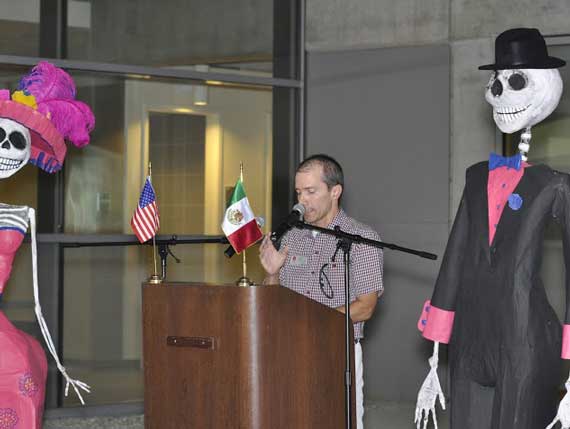Male presentor behind a podium giving a speech